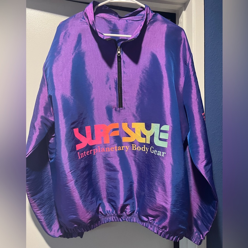Bright purple quarter-zip windbreaker